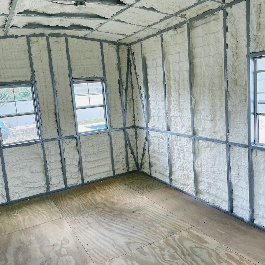 Closed-cell spray foam insulation applied to wall cavities in a residential project in Tomah